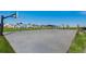 A community park featuring basketball court, playground, covered picnic area, and walking paths at 5913 Sawdust Dr, Brighton, CO 80601