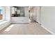 Spacious carpeted living room with an open floor plan and an abundance of natural light at 5913 Sawdust Dr, Brighton, CO 80601