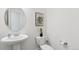 Modern powder bath featuring a stylish mirror and a sleek, space-saving design at 953 Compass Dr, Erie, CO 80516