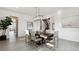 Bright dining room with large dining table with room to seat six, and modern lighting at 953 Compass Dr, Erie, CO 80516