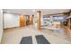 Spacious basement features a living area, bar, fireplace, tile floor, and beautiful windows at 46093 Bristlecone Ct, Parker, CO 80138