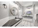 Updated bathroom featuring double vanities, subway tile, and modern fixtures at 46093 Bristlecone Ct, Parker, CO 80138