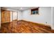 Bedroom has wood floors, a walk-in closet, and a large window at 46093 Bristlecone Ct, Parker, CO 80138