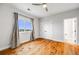 Bedroom with wood floors and a view of the outdoors at 46093 Bristlecone Ct, Parker, CO 80138