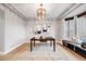 Bright dining room with a bay window, tray ceiling and chandelier at 46093 Bristlecone Ct, Parker, CO 80138