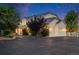 Exterior shot of a large home with a three-car garage and spacious asphalt driveway at 46093 Bristlecone Ct, Parker, CO 80138