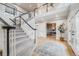 Spacious foyer with a view of the staircase and a glimpse into adjacent living spaces at 46093 Bristlecone Ct, Parker, CO 80138