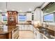 Beautiful kitchen with white cabinets, granite countertops, stainless steel appliances, and tile backsplash at 46093 Bristlecone Ct, Parker, CO 80138