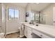 Bathroom with shower, vanity, and large mirror at 7725 S Cove Cir, Centennial, CO 80122