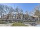 Exterior view of townhouses with landscaping and picnic tables at 7725 S Cove Cir, Centennial, CO 80122