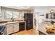 Well-equipped kitchen featuring modern appliances and white cabinetry at 7725 S Cove Cir, Centennial, CO 80122