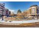 SouthGlenn Town Square with fountain and snow-covered landscaping at 7725 S Cove Cir, Centennial, CO 80122