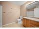 Functional bathroom with vanity, ample counter space, and a large mirror and tile flooring at 11640 W 62Nd Pl # 203, Arvada, CO 80004