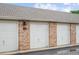 Photo showcasing the row of garages, providing secure and convenient parking options for residents at 11640 W 62Nd Pl # 203, Arvada, CO 80004