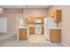 Compact kitchen with light wood cabinets, open to the living room, ideal for easy entertaining at 11640 W 62Nd Pl # 203, Arvada, CO 80004