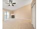 Bright living room featuring neutral carpeting, a fireplace, and sliding glass door to a private balcony at 11640 W 62Nd Pl # 203, Arvada, CO 80004