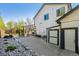 Large backyard with a patio, outdoor seating, a storage shed, and well-kept landscaping at 1300 W 13Th Ave, Broomfield, CO 80020