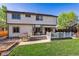 Spacious backyard features a lush lawn, outdoor seating, a grill, and a manicured garden at 1300 W 13Th Ave, Broomfield, CO 80020