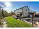 Large backyard with a deck, outdoor seating, a well-manicured lawn, and a privacy fence at 1300 W 13Th Ave, Broomfield, CO 80020