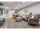 Relaxing finished basement featuring a living area, dining table, comfortable seating, and carpet flooring at 1300 W 13Th Ave, Broomfield, CO 80020