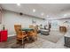 Finished basement with a game table, living area, comfortable seating, and wood-look floors at 1300 W 13Th Ave, Broomfield, CO 80020