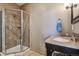Bathroom with walk-in shower, granite counter and modern fixtures at 1300 W 13Th Ave, Broomfield, CO 80020