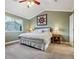 Comfortable bedroom with vaulted ceiling, neutral colors, and soft carpeting at 1300 W 13Th Ave, Broomfield, CO 80020
