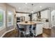 Beautiful kitchen with island and seating, stainless steel appliances, hardwood floors at 1300 W 13Th Ave, Broomfield, CO 80020