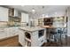 Bright, modern kitchen with a central island, stylish pendants, and an open layout to the living area at 1300 W 13Th Ave, Broomfield, CO 80020