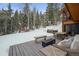 Deck with fire pit and seating area at 65 Cottonwood Dr, Evergreen, CO 80439