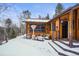 Exterior of home with snowy yard at 65 Cottonwood Dr, Evergreen, CO 80439