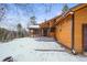 Exterior view of home with snowy yard at 65 Cottonwood Dr, Evergreen, CO 80439