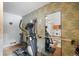 Home gym featuring an elliptical and wall-mounted mirror at 65 Cottonwood Dr, Evergreen, CO 80439