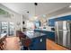 Stylish kitchen with blue cabinetry, an island, and hardwood floors at 65 Cottonwood Dr, Evergreen, CO 80439