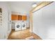 Convenient laundry room with washer, dryer, and extra storage at 65 Cottonwood Dr, Evergreen, CO 80439