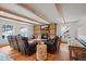 Relaxing living room with exposed beams, a fireplace, and leather furniture at 65 Cottonwood Dr, Evergreen, CO 80439