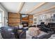 Cozy living room featuring a fireplace, exposed beams, and comfortable seating at 65 Cottonwood Dr, Evergreen, CO 80439