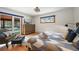 Main bedroom with private access to balcony and wood floors at 65 Cottonwood Dr, Evergreen, CO 80439