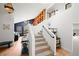 Elegant staircase with built-in shelving and wood floors at 65 Cottonwood Dr, Evergreen, CO 80439