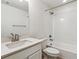 Clean bathroom with a shower/tub combo and white tile at 674 Penn Rd, Elizabeth, CO 80107