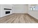 Living room with fireplace and built-in shelving at 674 Penn Rd, Elizabeth, CO 80107