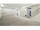 A large finished basement area with carpet and white walls at 7065 Ingalls Ct, Arvada, CO 80003