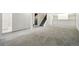 A finished basement space with carpet and stairs to the first floor at 7065 Ingalls Ct, Arvada, CO 80003