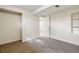 Basement bedroom featuring neutral paint, carpeting, closet, and built-in shelves at 7065 Ingalls Ct, Arvada, CO 80003