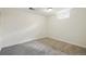 Finished basement bedroom with neutral paint and carpeting and a bright egress window at 7065 Ingalls Ct, Arvada, CO 80003