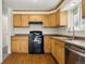 Updated kitchen featuring light wood cabinets, stainless steel appliances, and hardwood floors at 7065 Ingalls Ct, Arvada, CO 80003