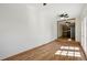 Open floor plan living room with hardwood floors and natural light at 7065 Ingalls Ct, Arvada, CO 80003