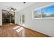 Open floor plan living room with hardwood floors and natural light at 7065 Ingalls Ct, Arvada, CO 80003