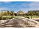 Outdoor amphitheater with lush landscaping, tiered seating, and views of nearby modern residences at 3171 Fulton St, Denver, CO 80238