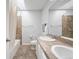 Bathroom with tub-shower combo, double sinks and vanity with ample storage space at 3171 Fulton St, Denver, CO 80238